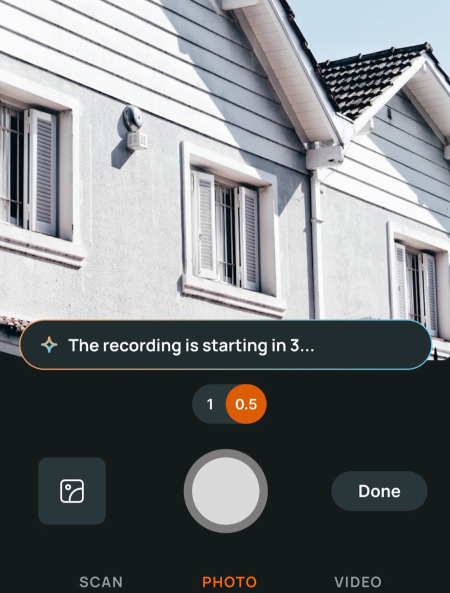 Field Inspect camera screen starting a voice recording in front of a house